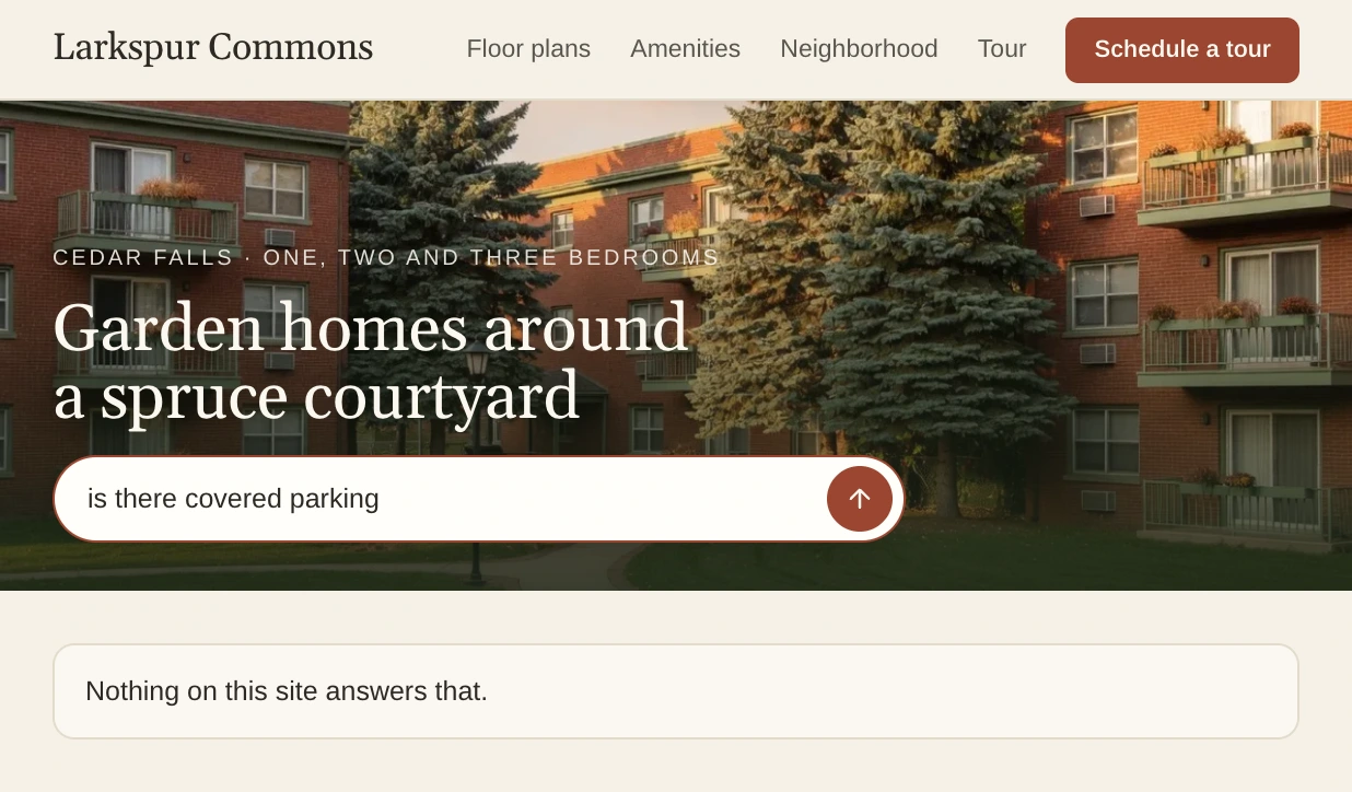 Larkspur Commons's home page, where a visitor asks if there is covered parking and the site answers that nothing on it answers that.