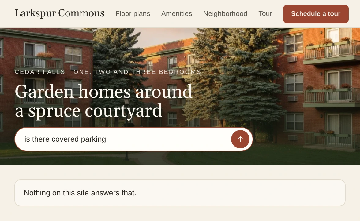 Larkspur Commons's home page, where a visitor asks if there is covered parking and the site answers that nothing on it answers that.