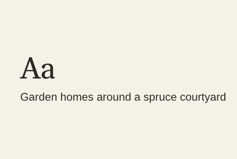 Larkspur Commons's type sample: a large serif Aa over the line Garden homes around a spruce courtyard, dark ink on cream.