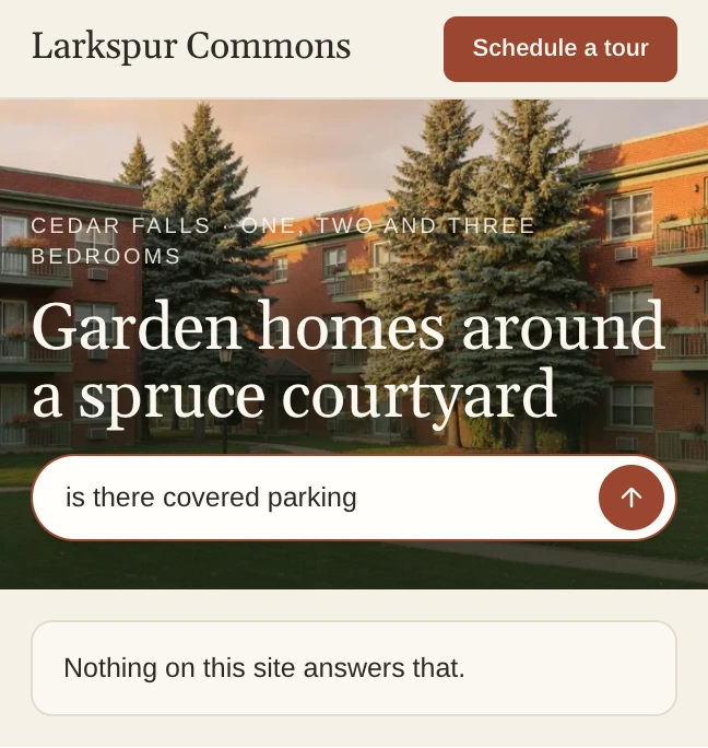 Larkspur Commons's home page, where a visitor asks if there is covered parking and the site answers that nothing on it answers that.